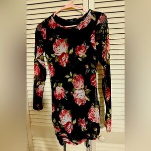 Short black dress with an inner piece and a soft outer piece.